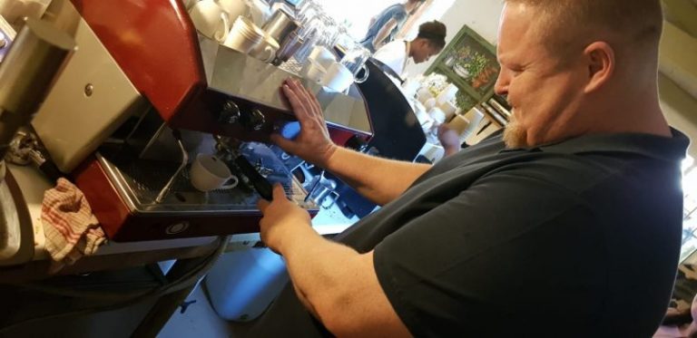 Francois du Toit learning to make coffee using a barista machine