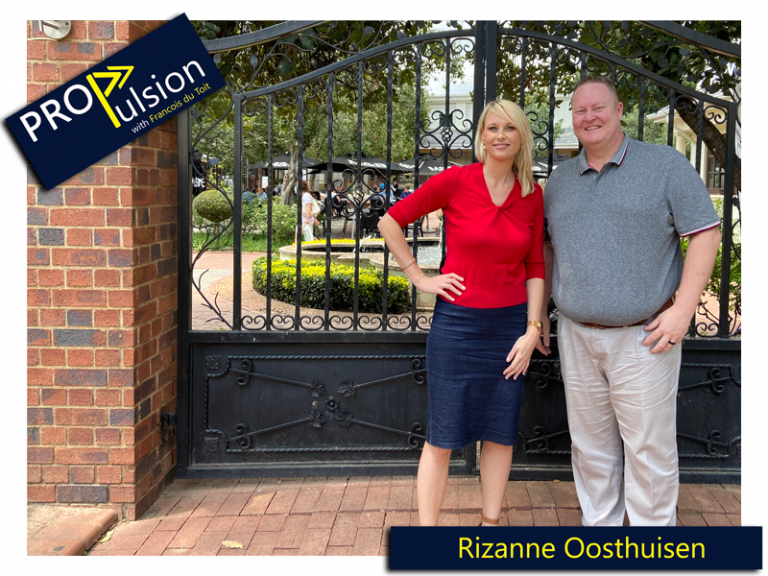 rizanne oosthuisen and francois du toit posing in front of a black steel gate
