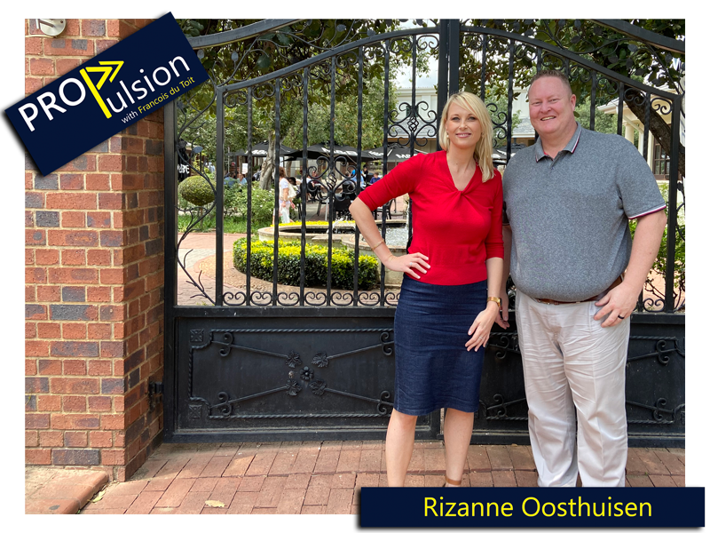 rizanne oosthuisen and francois du toit posing in front of a black steel gate